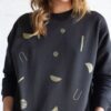 Sudadera oversize negra estampado eclipse algodón orgánico