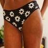 Braga negra con estampado de flores blancas