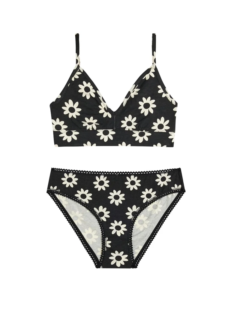 Conjunto de bralette y braga negros con estampado de flores blancas