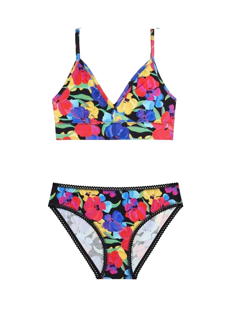 Conjunto de bralette de tirantes y braga con estampado floral multicolor sobre fondo negro